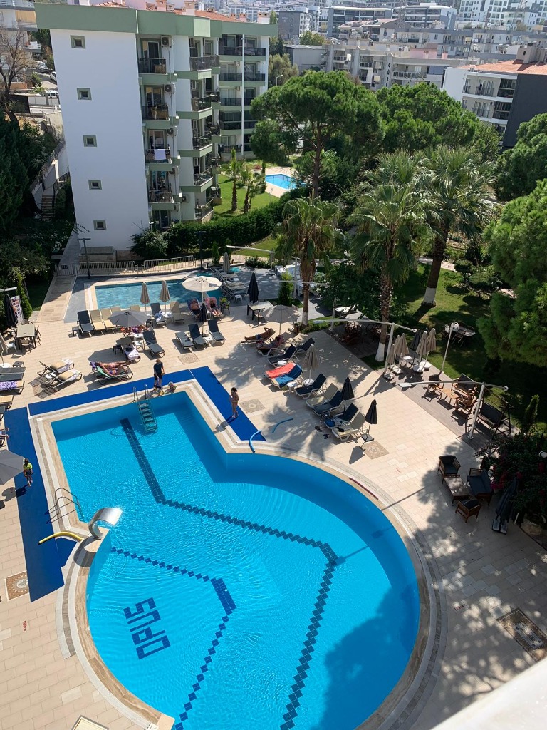 Opus Apart Main Pool and Garden Aerial View