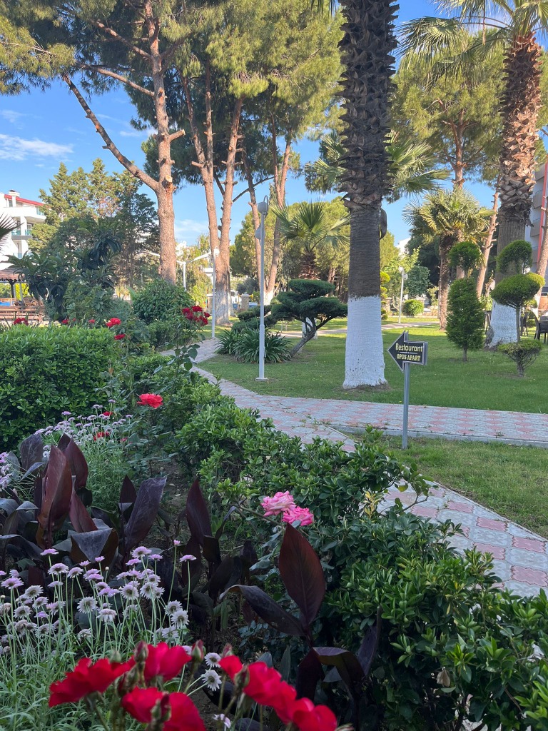 Opus Apart Blooming Garden and Restaurant Path